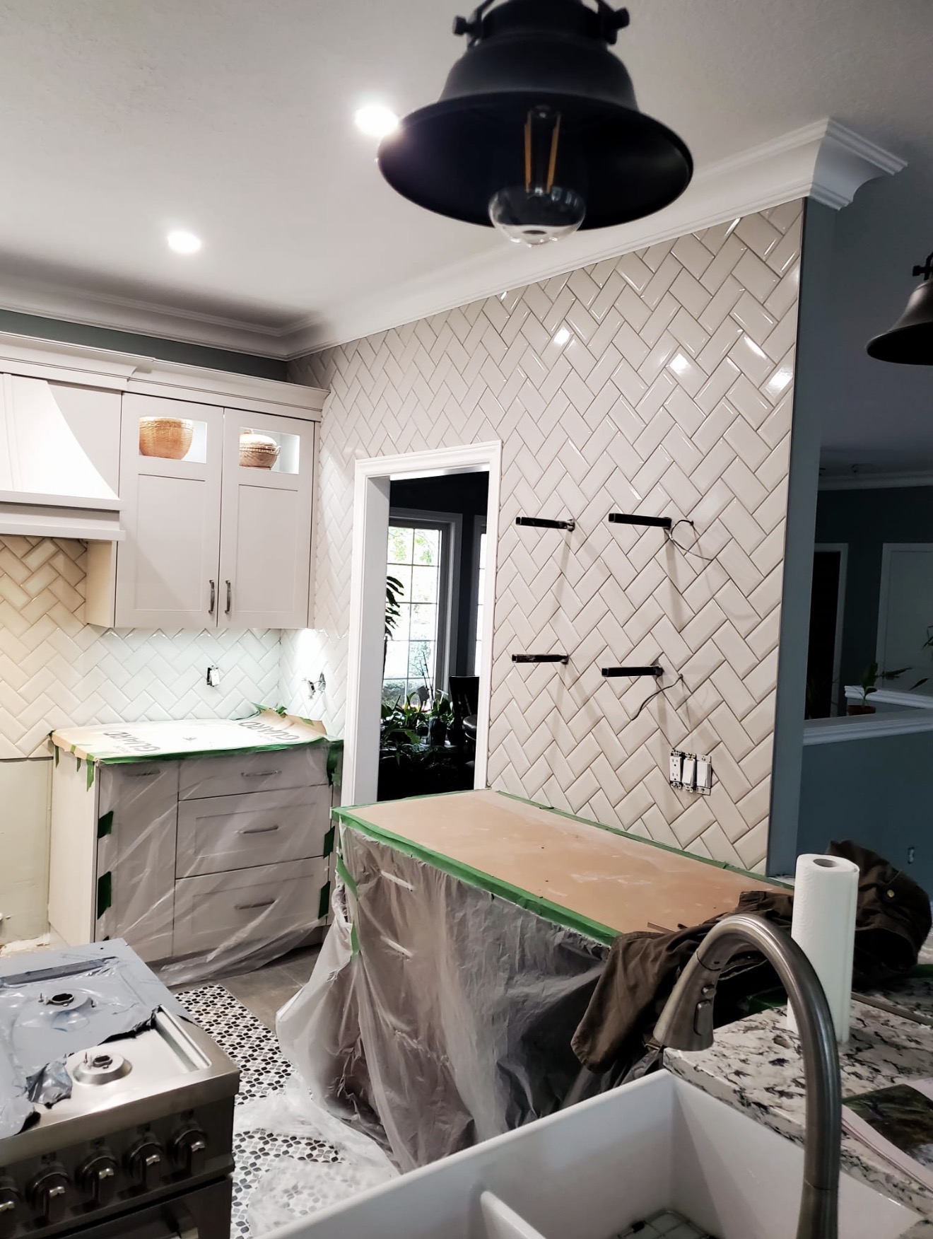Herringbone subway tile backsplash in a London, Ontario kitchen by LevelUp